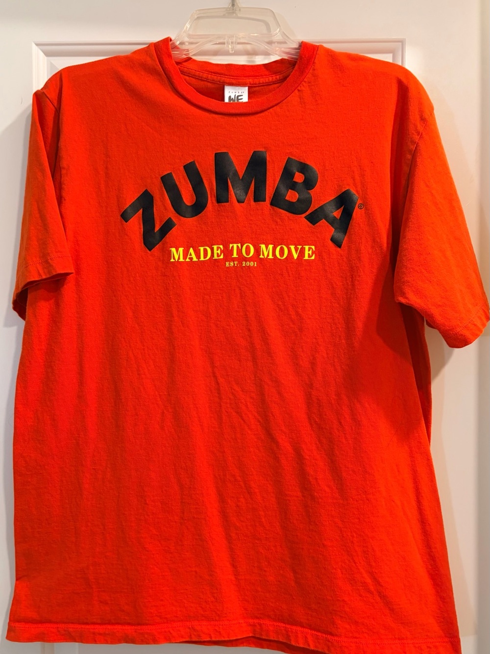 Zumba Fitness Bright Orange Tee with Black Logo and Yellow Text